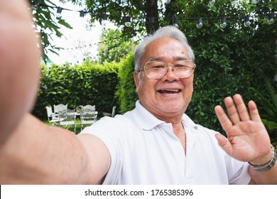 Asian Senior Man Selfie While Video Call With Family