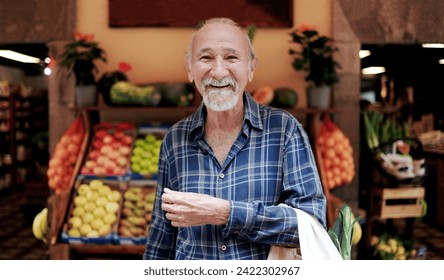 Asian senior man shopping at farm market. Customer buying at grocery store. Small business concept - Powered by Shutterstock