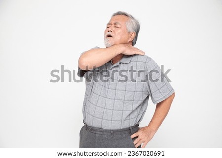 Asian senior man with shoulder pain isolated on white background, Spinal degeneration or Dislocated back bone herniated spinal disc concept