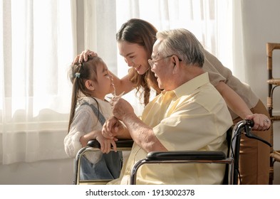 Asian Senior Man Was Sick And Sitting On Wheelchair. Retirement Age Lifestyle And Togetherness With Family At Home.