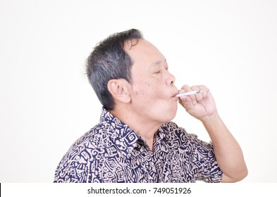 Asian Senior Man Smoking Cigarette