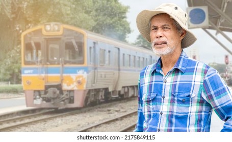 Asian Senior Man Standing At The Train Station