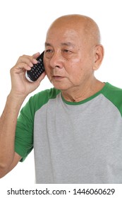 Asian Senior Man Talking On Cordless Phone. Isolated On White Wall Background