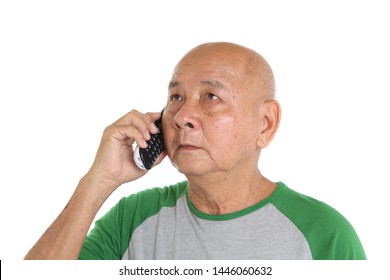 Asian Senior Man Talking On Cordless Phone. Isolated On White Wall Background