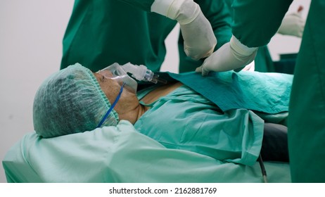 Asian Senior Man Undergoing Heart Surgery In The Operating Room