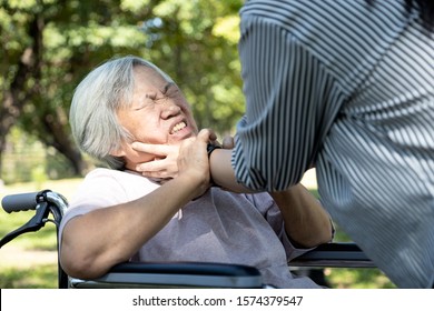 Asian Senior Mother Were Physically Abused,angry Daughter Or Female Caregiver Use Hands To Strangle Old People Neck And Fight, Hit, Attack,physical Abuse Elderly Alzheimer Patient,family Stop Violence