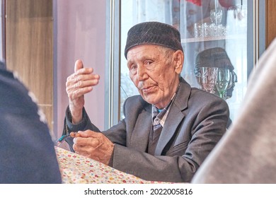 Asian Senior Muslim Man, Mullah Talking Gesturing With His Hands At Rural House