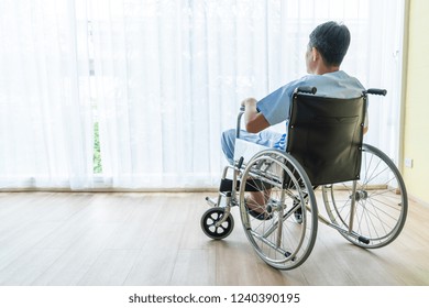 Asian Senior Patient Wheelchair In Empty Room