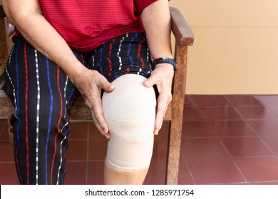 Asian Senior Woman With Bandage Compression Knee Brace Support Injury.