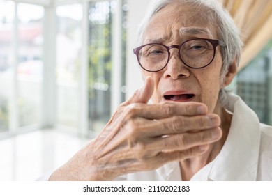 Asian Senior Woman Checking Breath And Breathe,old Elderly Have Bad Breath,bad Smell,stink,foul Mouth From Inside The Oral,tongue And Tooth Decay,dental Problems,halitosis,scurvy,health Care Concept