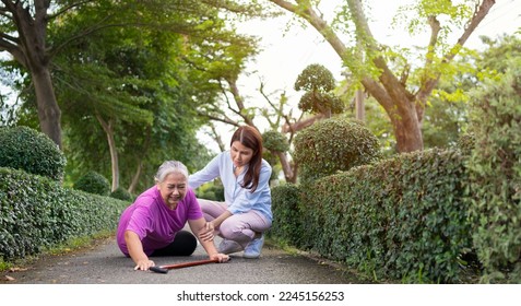 Asian senior woman fell down on lying floor because faint and limb weakness and Crying in pain form accident and her daughter came to help support. Concept of old elderly insurance and health care - Powered by Shutterstock