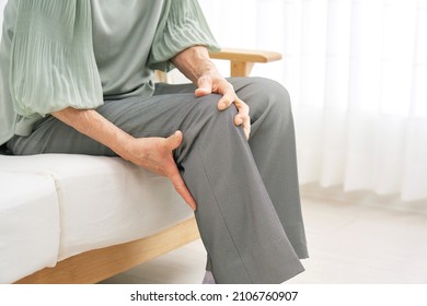 Asian senior woman having the joint pain, no face - Shutterstock ID 2106760907
