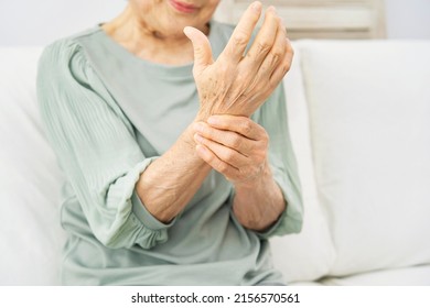 Asian Senior Woman Having The Joint Pain At Home, No Face