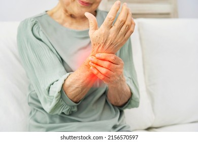 Asian Senior Woman Having The Joint Pain At Home, No Face