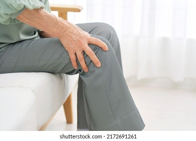 Asian Senior Woman Having The Joint Pain At Home