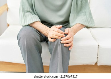 Asian Senior Woman  Having The Joint Pain At Home, No Face