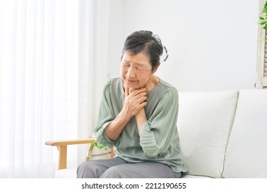 Asian Senior Woman Having Trouble Breathing