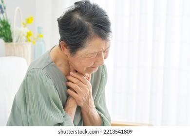 Asian Senior Woman Having Trouble Breathing