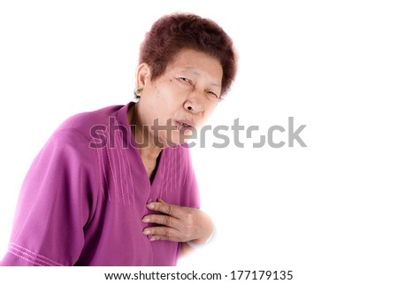 Asian senior woman with heart pain isolated on white background