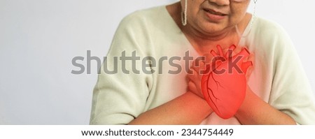 Asian senior woman holding with chest pain, health and medical, heart health, heart attack, world heart day, cardiovascular disease, doctor, treatmen.insurance and hospital concept