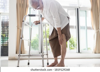 Asian Senior Woman With Knee Joint Pain,female Patient Having Aching Patella,arthritis,osteoarthritis Of The Knee,elderly People Touch On The Knee With Hand,pain In The Kneecap,physical Injury Concept