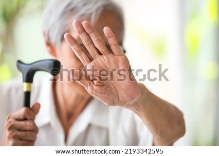 Asian senior woman making stop gesture with palm,against domestic violence,old people raising hand to show sign,stop bullying the elderly,physical harm,psychological damage,abuse,mistreatment concept