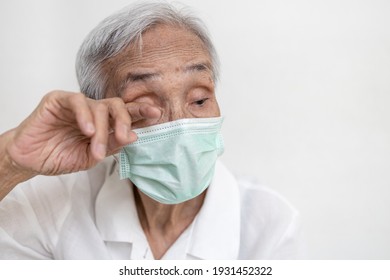 Asian Senior Woman In Medical Protective Mask Rubbing Her Eyes,Do Not Touch Eyes With Her Dirty Hand,avoid Touching To Protect Form COVID-19,risk Of Coronavirus Infection,Don't Touch Face,health Care