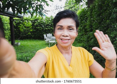 Asian Senior Woman Selfie While Video Call With Family