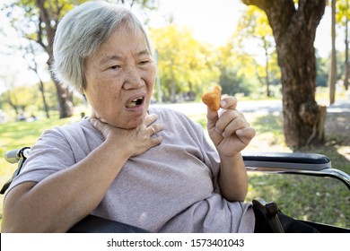 Asian Senior Woman Suffers From Choke And Cough,clogged Up Food,elderly People Choking During Feeding,food Might Stuck In The Throat And Suffocate With Sever Pain Injury, Asphyxia,suffocation Concept