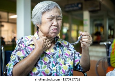 Asian Senior Woman Suffers From Choke,clogged Up Food,elderly People Choking During Feeding,food Might Stuck In The Throat And Suffocate With Sever Pain Injury,health Problem, Asphyxia,suffocation 