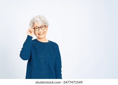 Asian senior woman wearing glasses - Powered by Shutterstock