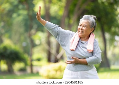 asian senior woman workout and practice tai chi in the park - Powered by Shutterstock