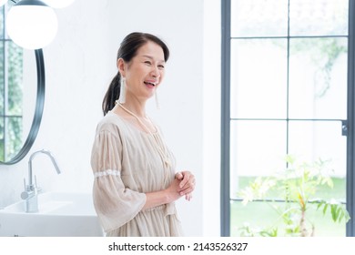 Asian Senior Women Dressing Up