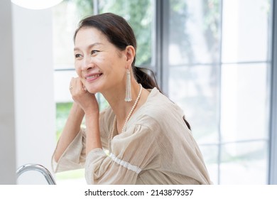 Asian Senior Women Dressing Up