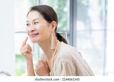 Asian Senior Women Dressing Up