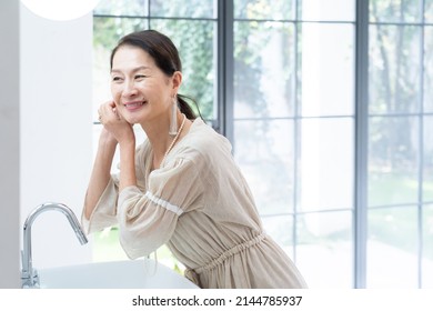 Asian Senior Women Dressing Up