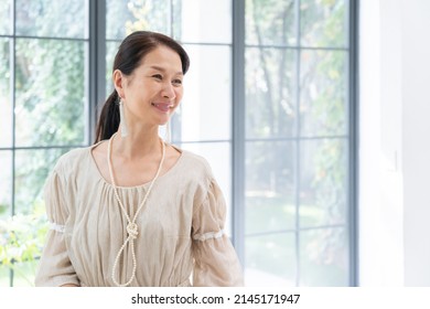 Asian Senior Women Dressing Up