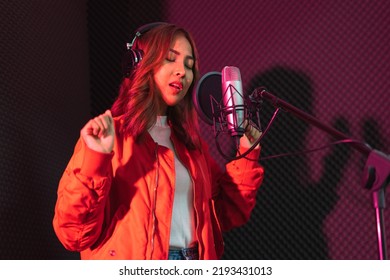 Asian Singer Woman In A Recording Studio Using A Studio Microphone With Passion In Music Recording Studio