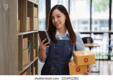 Asian small business owner working at home office. Business retail market and online sell marketing delivery, SME e-commerce concept - Shutterstock ID 2214912361