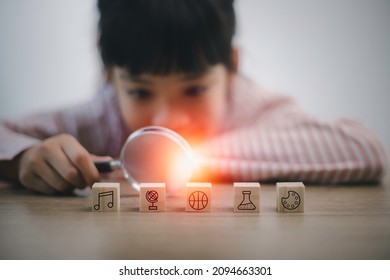 Asian smart kids girl using a magnifying glass to explore..skills to become geniuses. Number, Language, Motor Skill, Creative Thinking,