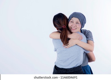 Asian Smiling, Happy Ovarian, Breast Cancer Woman With No Hair Recovery Chemo Hug Friend, Family Encouragement, Love, Care To Fight Severe Disease On White Background/ Medical Health Care Concept