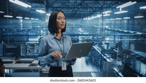 Asian Software Developer Analyze System Performance Metrics on a Laptop Inside a Modern Data Center. Young Female Manager Ensuring Efficient Operations for Critical Infrastructure - Powered by Shutterstock - Get 15% off with code: PIKWIZARD15