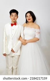 Asian Son Taking Wedding Photo With Mother