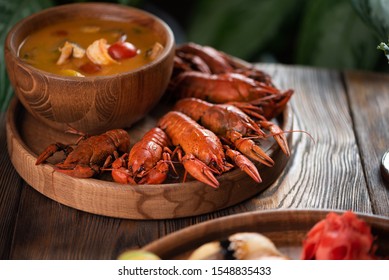  Asian soup and crayfish in a wooden bowl