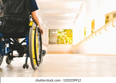 Asian special child on wheelchair is pushing his car on the ramp for the disabled., Life in the education age of children, Happy cerebral palsy kid concept.