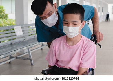 Asian Special Child On Wheelchair And Parent Wear Mask Protection Flu Covid 19 Or Coronavirus When To Do Outdoor Activities, New Normal To Prevent The Spread Of The Virus Disease 2020.