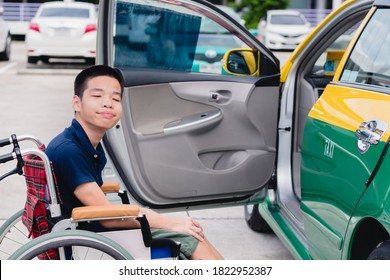 Asian Special Child On Wheelchair By The Car Door Going Up On A Car Parked In A Disabled Parking Space, Using A Disabled  Children Vehicle, Happy Special Need Kids Concept.