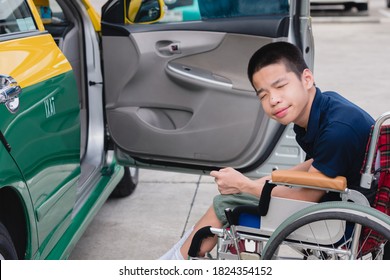 Asian Special Child On Wheelchair By The Car Door Going Up On A Car Parked In A Disabled Parking Space, Using A Disabled  Children Vehicle, Happy Special Need Kids Concept.