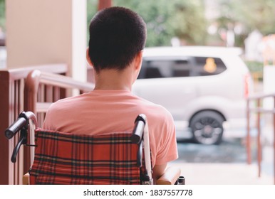 Asian Special Child On Wheelchair Waiting The Car On Ramp For Disabled People In Parking Space, Life In The Education Age And Public Transport Of Disability Children,Happy Special Need Kids Concept.