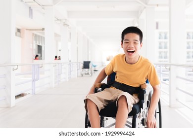 Asian special child on wheelchair is smiling face as happiness on ramp for disabled people background in hospital, Lifestyle in the education age of disabled children, Happy disability kid concept. - Powered by Shutterstock